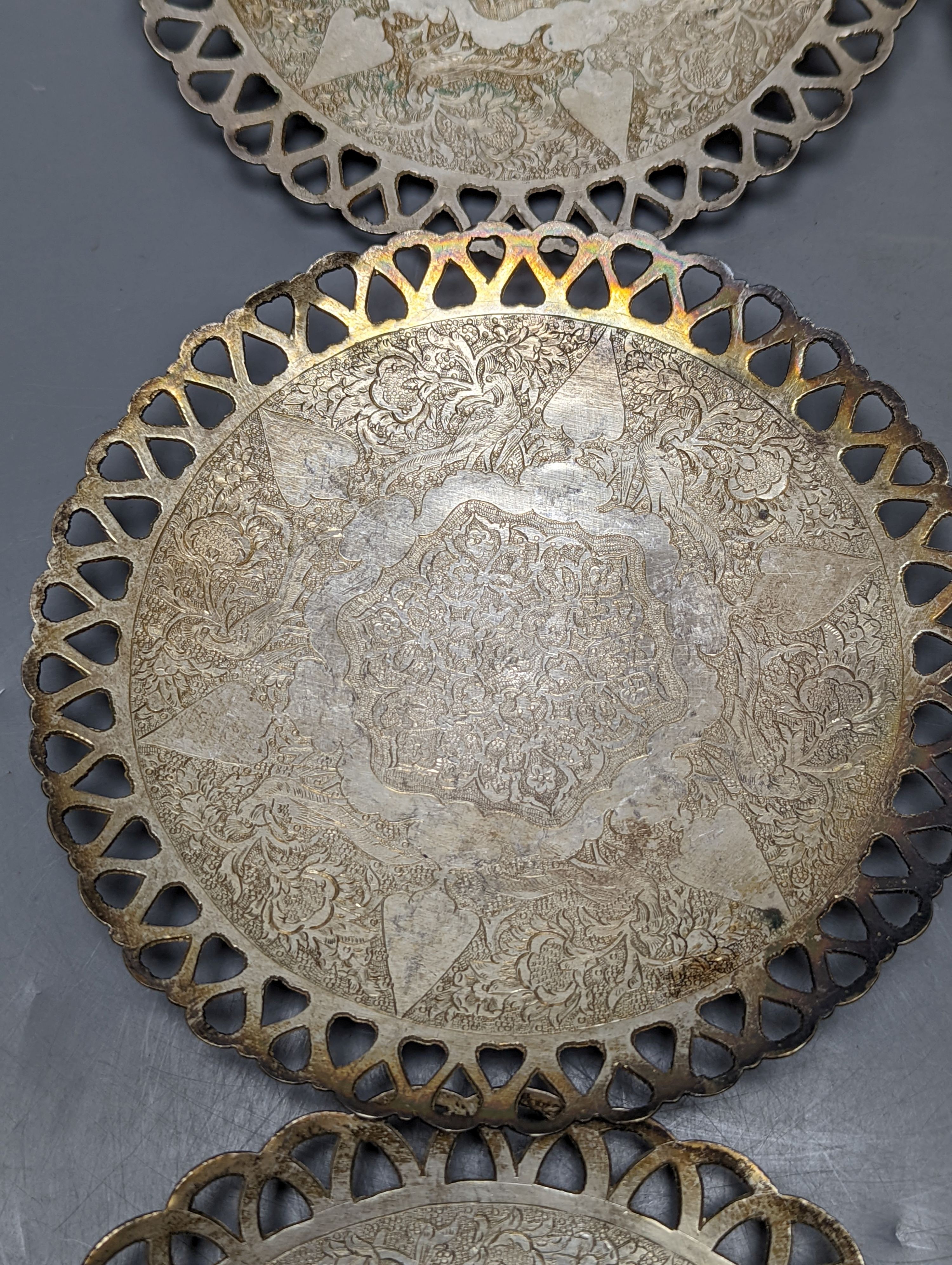 A set of six Persian white metal circular shallow dishes, with pierced borders, 16.3cm, 972 grams.